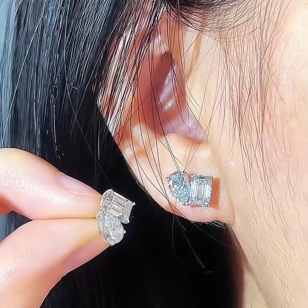 Close-up of diamond earrings being worn on an ear