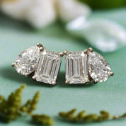 Diamond earrings on a textured black background
