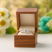 Diamond ring in a wooden box with a natural background