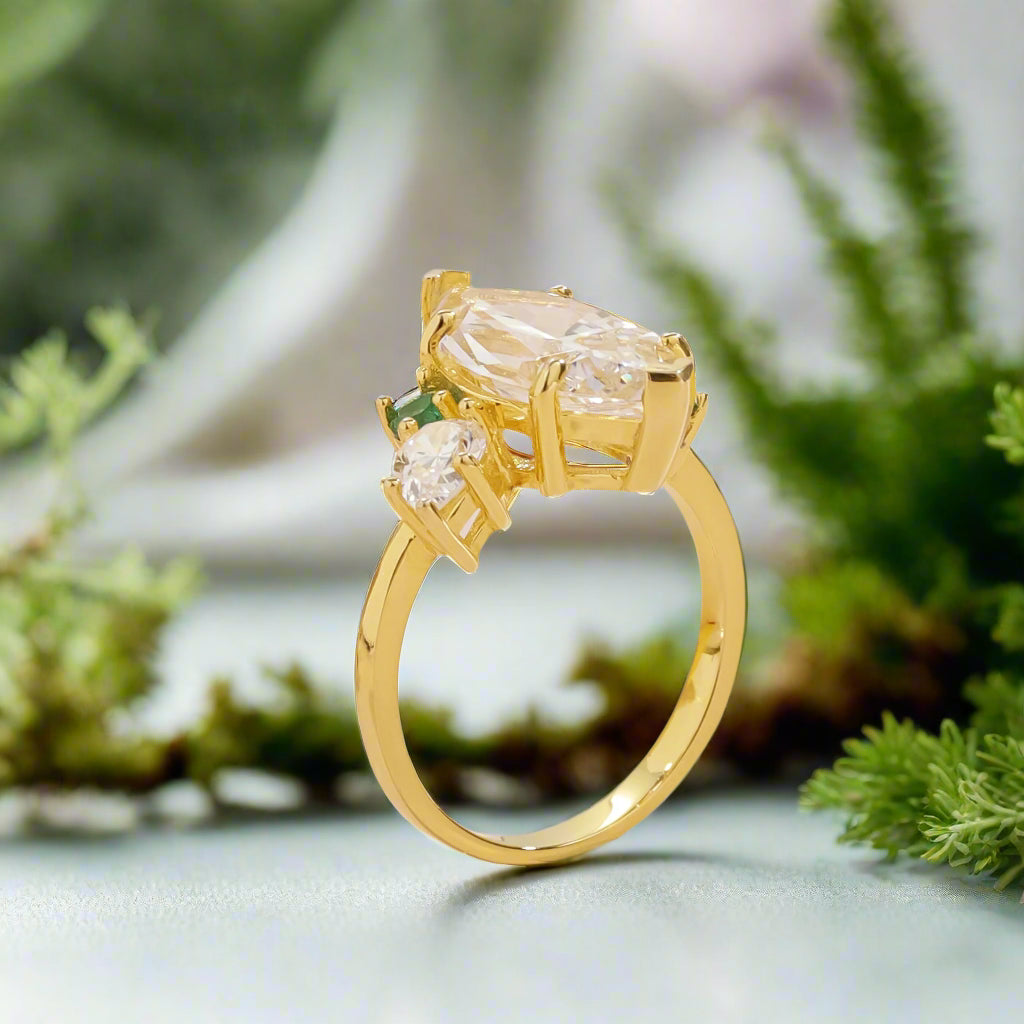 Gold ring with gemstones on a light background