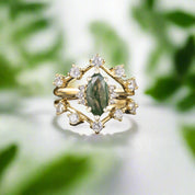 Gold ring with green gemstone and diamonds on a dark background