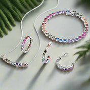 Jewelry set with multicolored gemstones on a white background