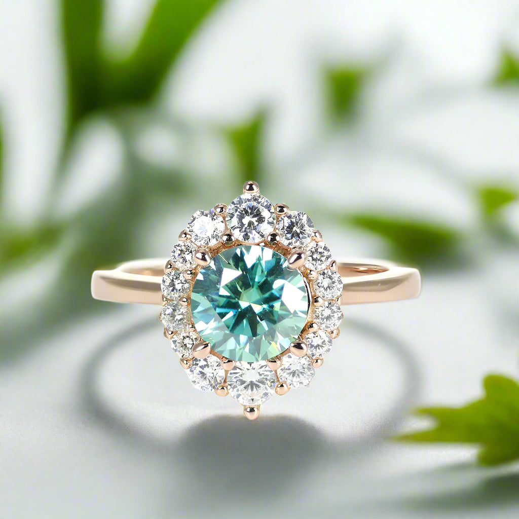 Luxury ring with a large green gemstone and smaller diamonds on a white background