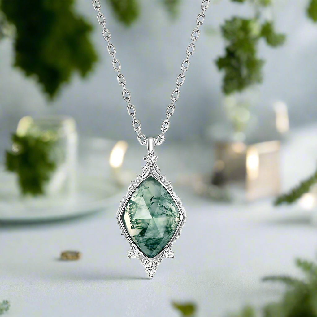 Necklace with a green gemstone pendant on a white background