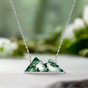 Necklace with a green marbled pendant on a white background