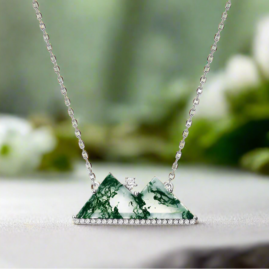 Necklace with a green marbled pendant on a white background