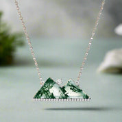 Necklace with a green marbled pendant on a white background