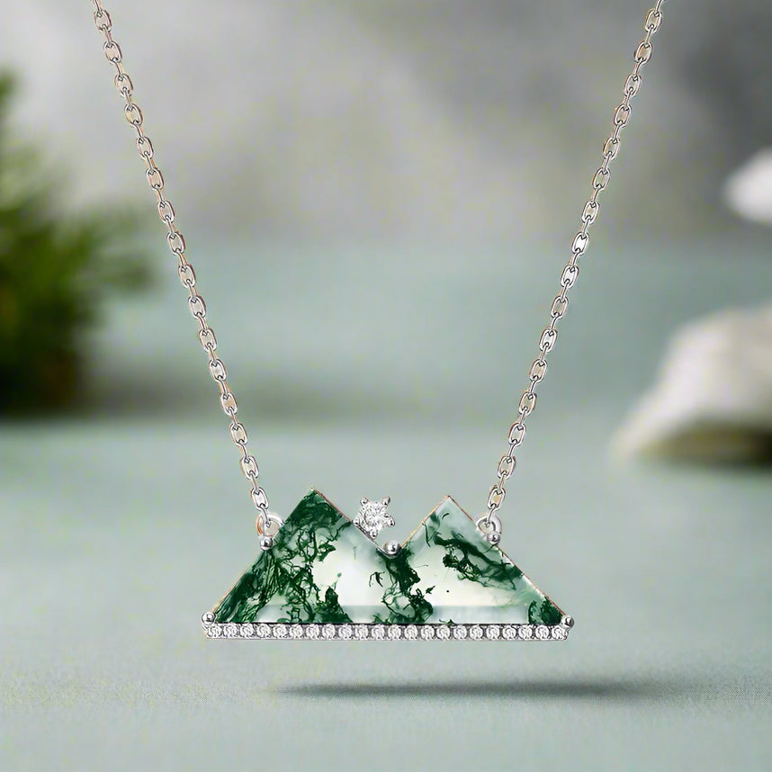 Necklace with a green marbled pendant on a white background