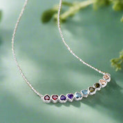 Necklace with colorful gemstones on a white background