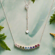 Necklace with colorful gemstones on a white background