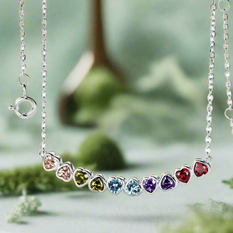 Necklace with heart-shaped gemstones on a white background