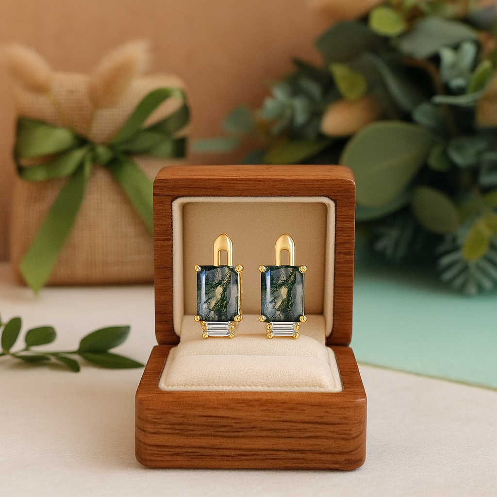 Pair of earrings in a wooden box with a decorative background