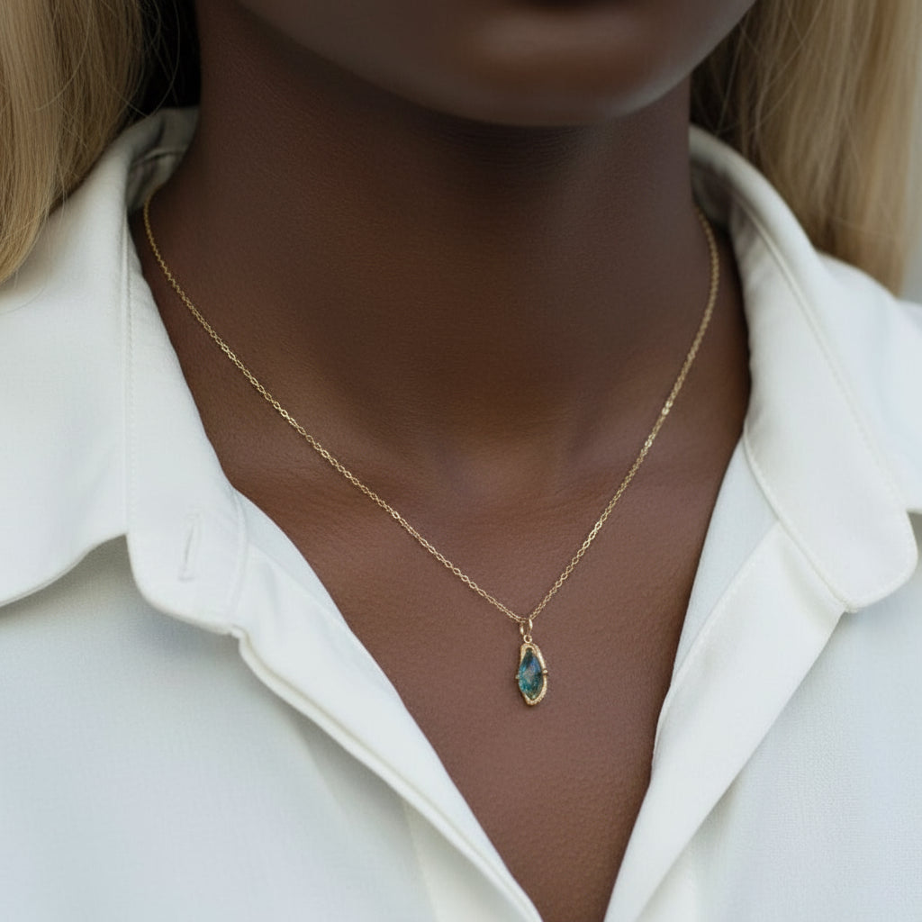 Necklace with a pendant on a mannequin wearing a white coat