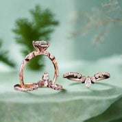 Two rose gold rings with gemstones on a dark background