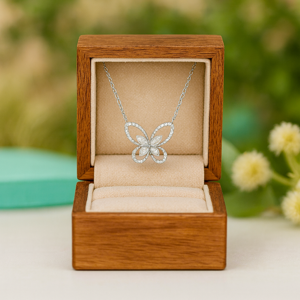 Butterfly necklace in a wooden box with a natural background