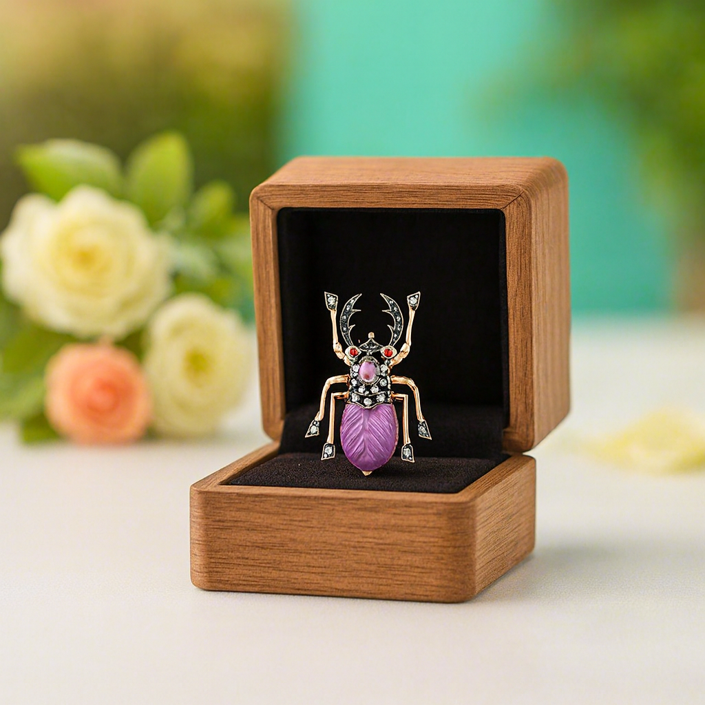 Decorative brooch in a wooden box with flowers in the background