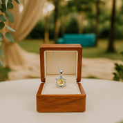 Diamond necklace in a wooden box with a blurred outdoor background