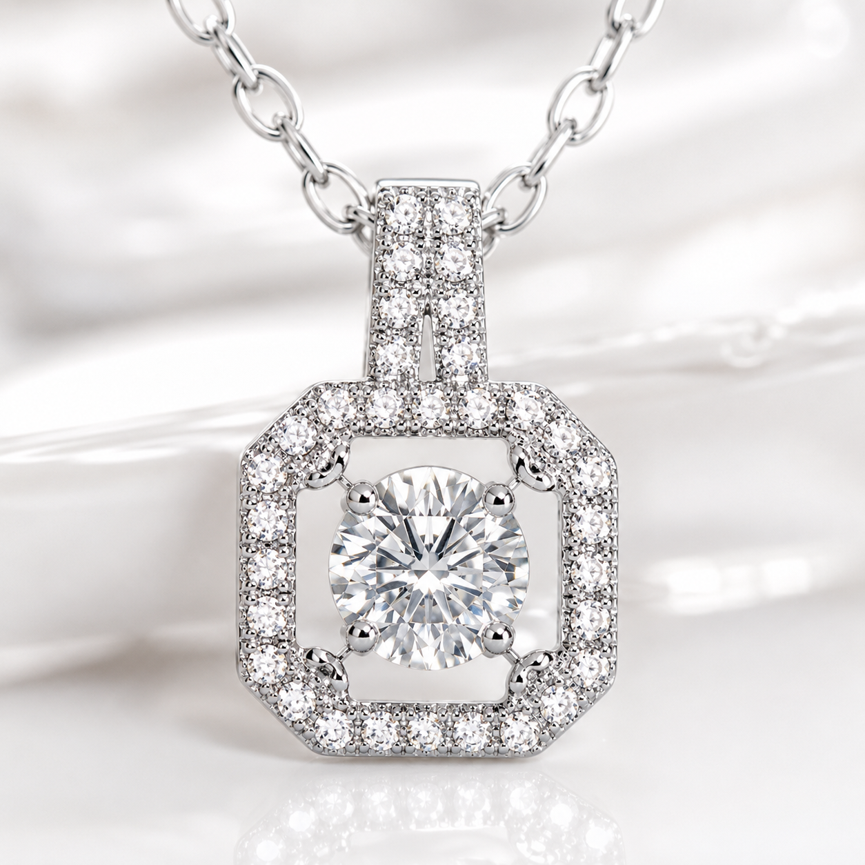Diamond necklace with a hexagonal pendant on a soft white background