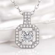 Diamond necklace with a hexagonal pendant on a soft white background