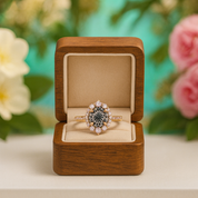 Diamond ring in a wooden box with flowers in the background