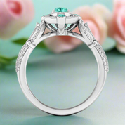 Elegant ring with a central turquoise gemstone and diamond accents on a white background