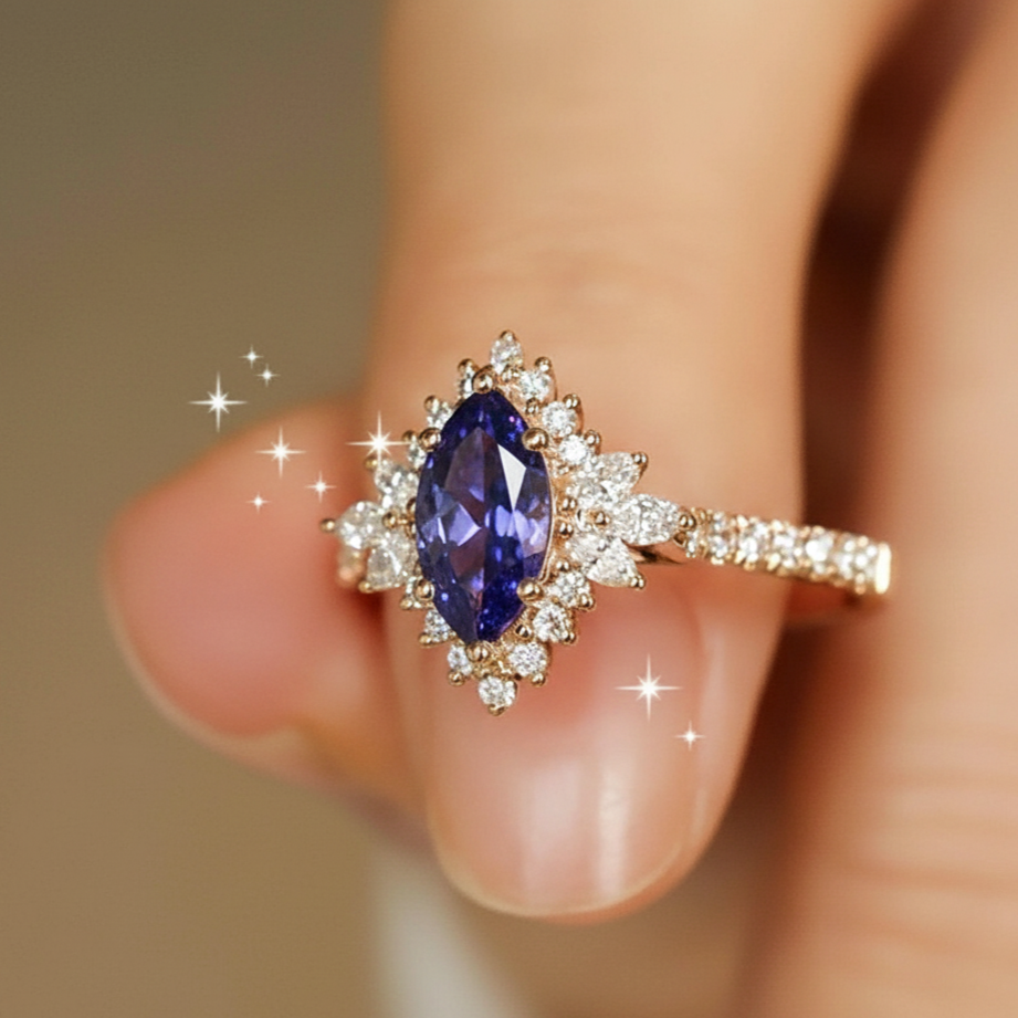 Gold ring with a purple gemstone on a finger against a neutral background