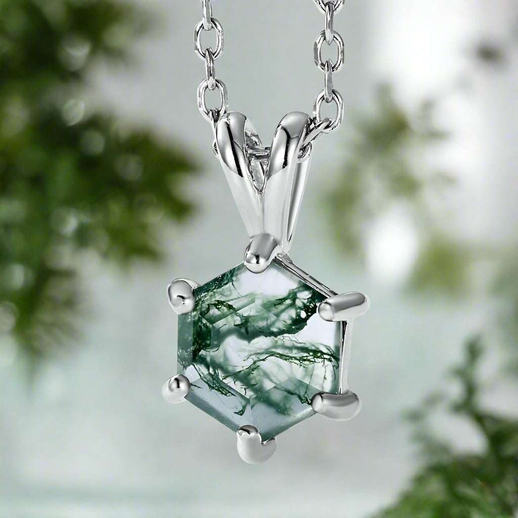 Green gemstone pendant on a silver chain