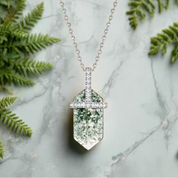Necklace with a green pendant on a white background