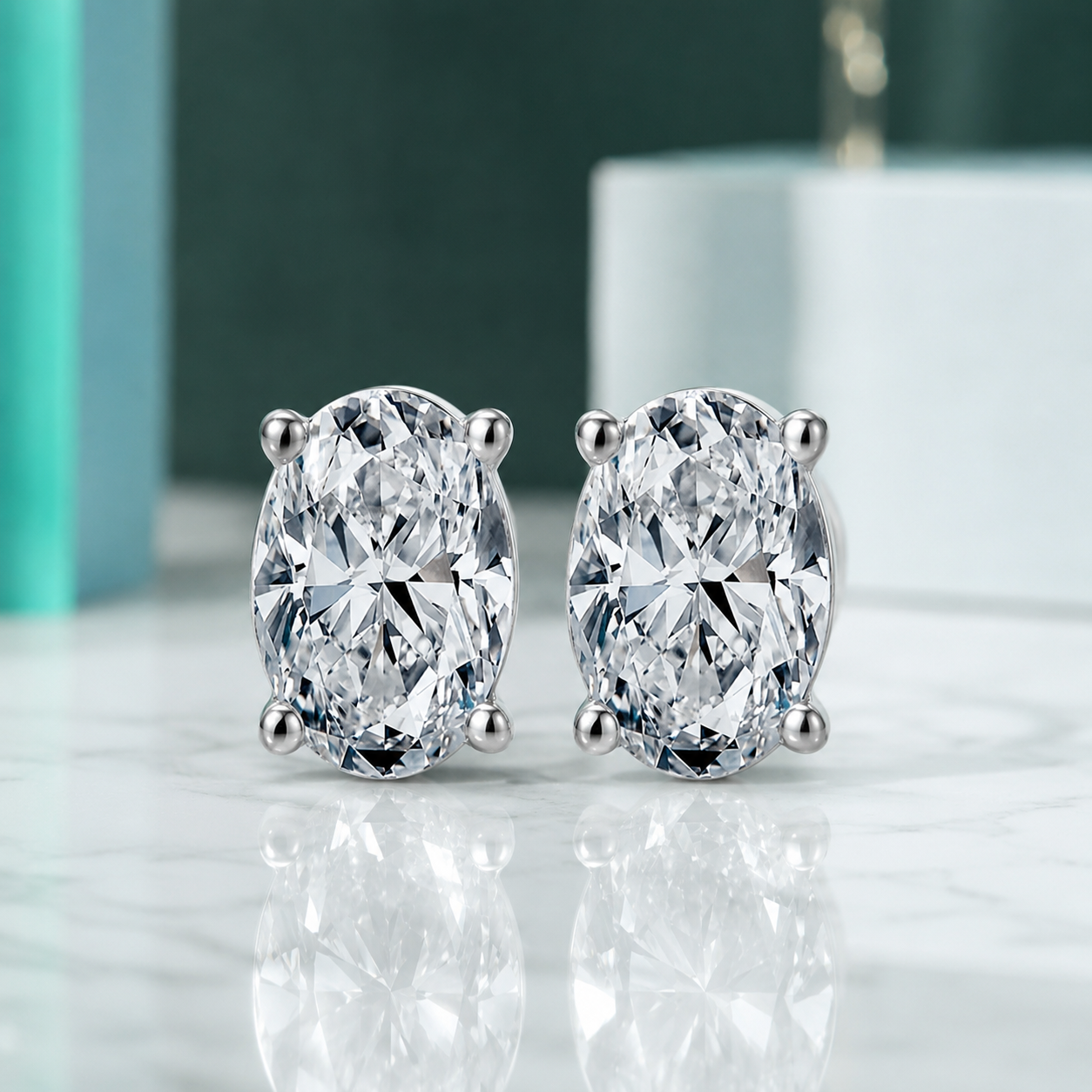 Pair of diamond stud earrings on a reflective surface with a blurred background