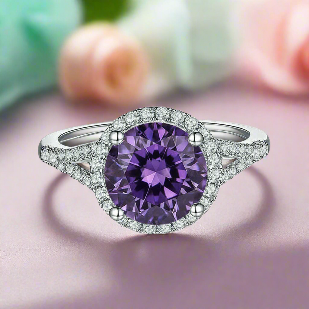 Ring with a purple gemstone and diamond-studded band on a white background