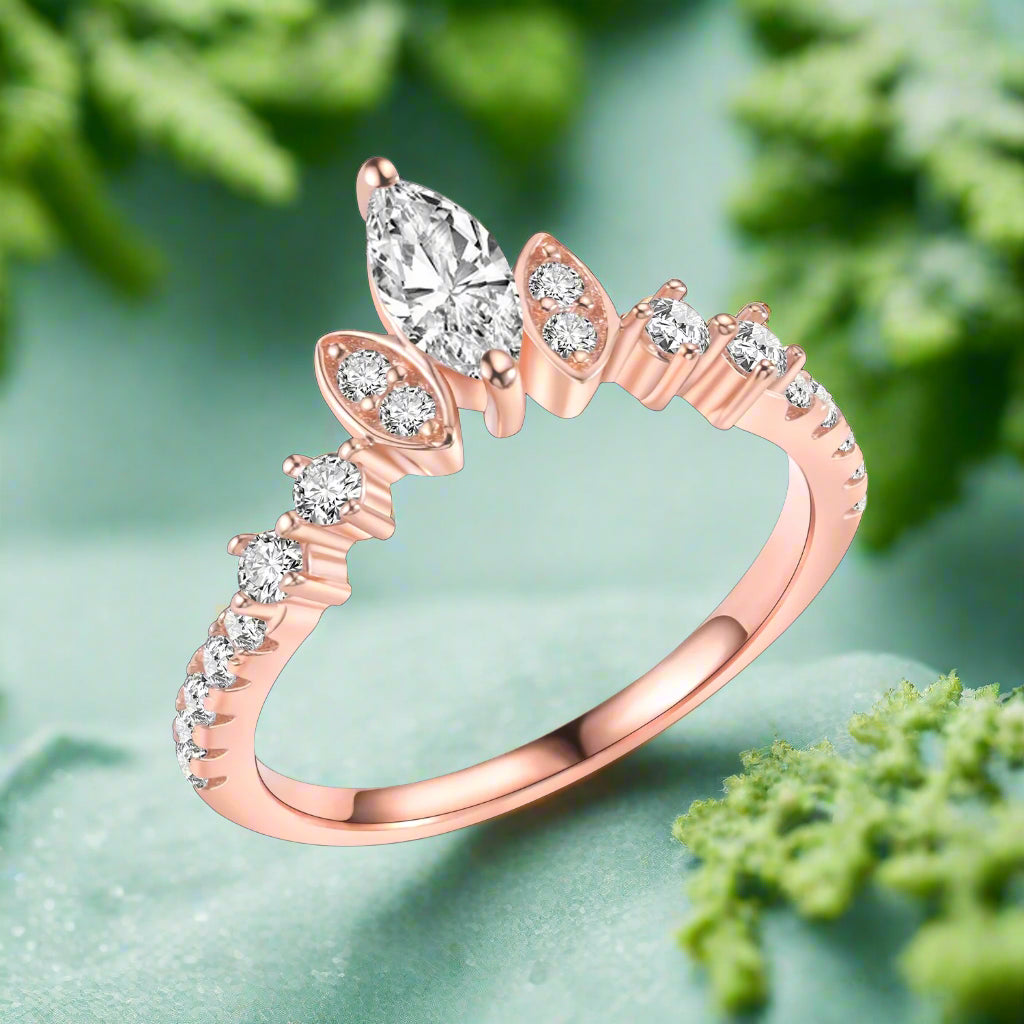 Rose gold ring with diamond accents on a white background