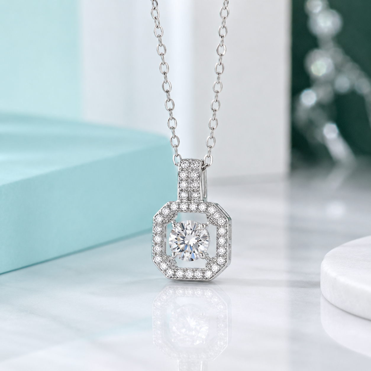 Silver necklace with a diamond pendant on a light background