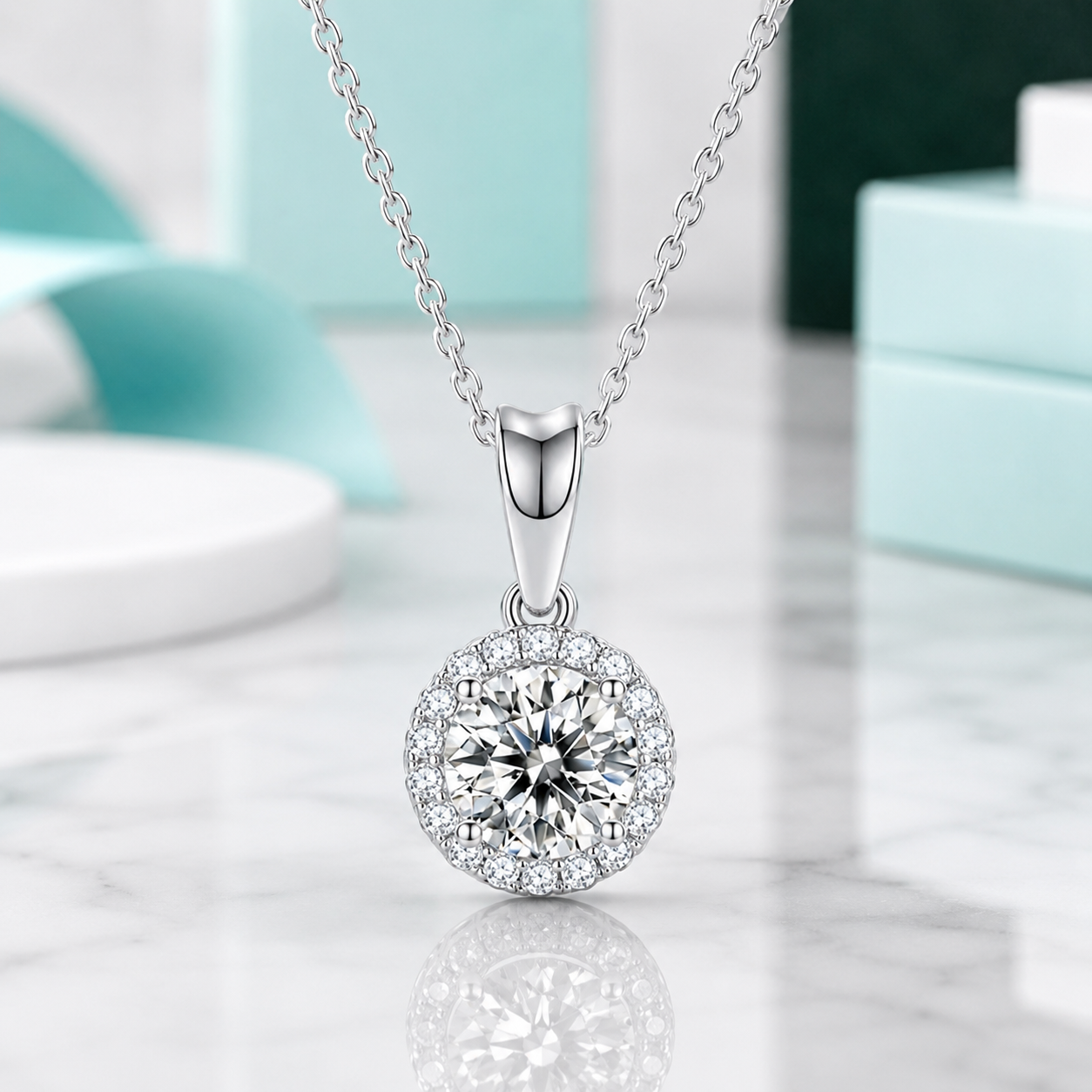 Silver necklace with a round pendant on a reflective surface