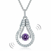 Silver pendant with a purple gemstone on a white background