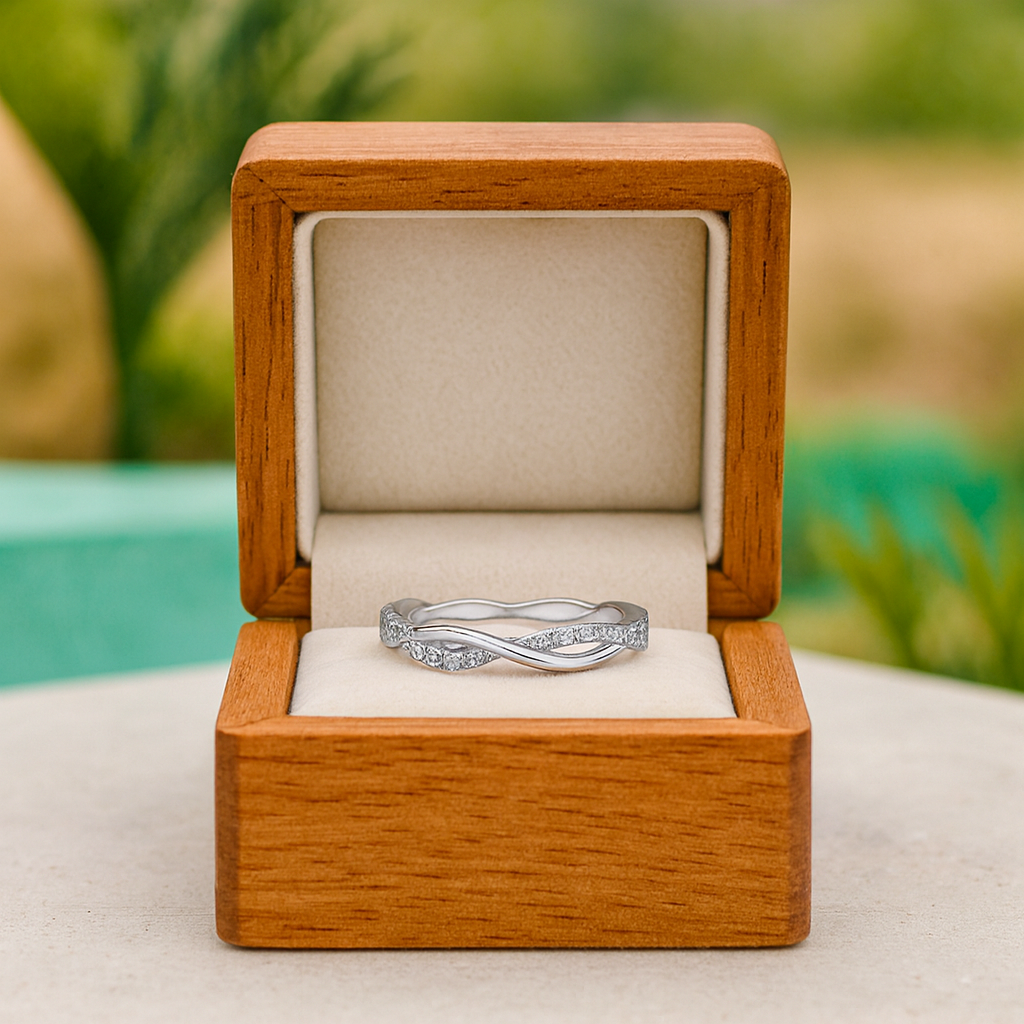 Silver ring in a wooden box with a blurred natural background