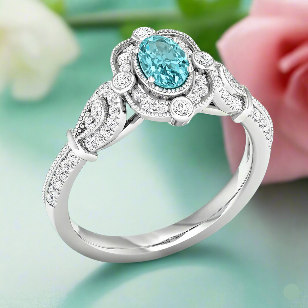 Silver ring with a blue gemstone on a light green background