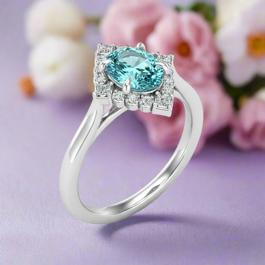 Silver ring with a blue gemstone on a white background