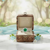 Silver ring with a green gemstone on a white background