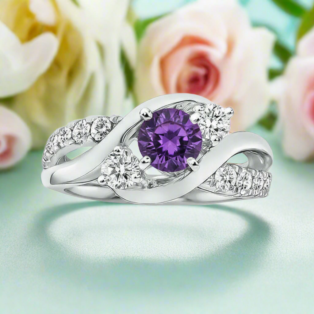 Silver ring with a purple gemstone and diamond accents on a white background