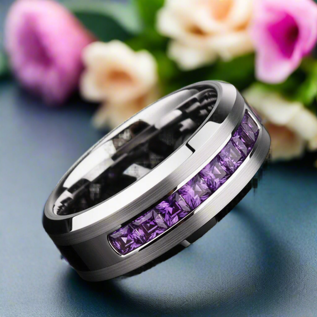 Silver ring with purple gemstones on a black background