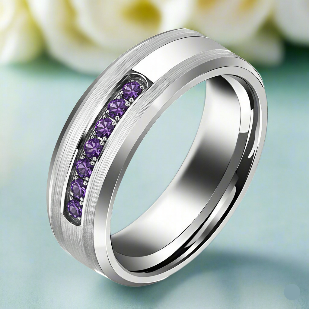 Silver ring with purple gemstones on a light blue background