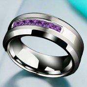 Silver ring with purple gemstones on a light blue background