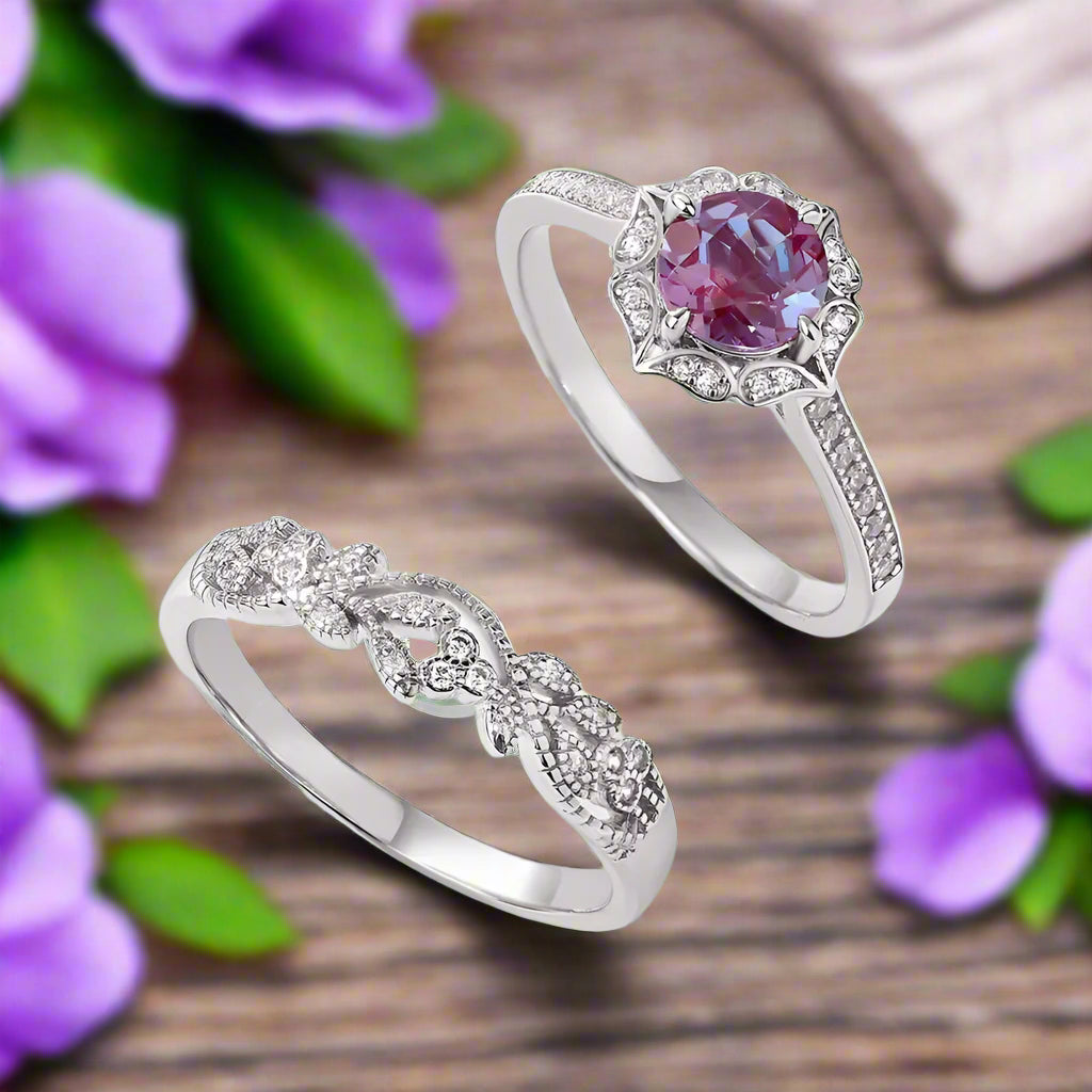 Two silver rings with gemstones on a light gray background