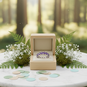 Wooden ring box with a ring on a marble table in a forest setting